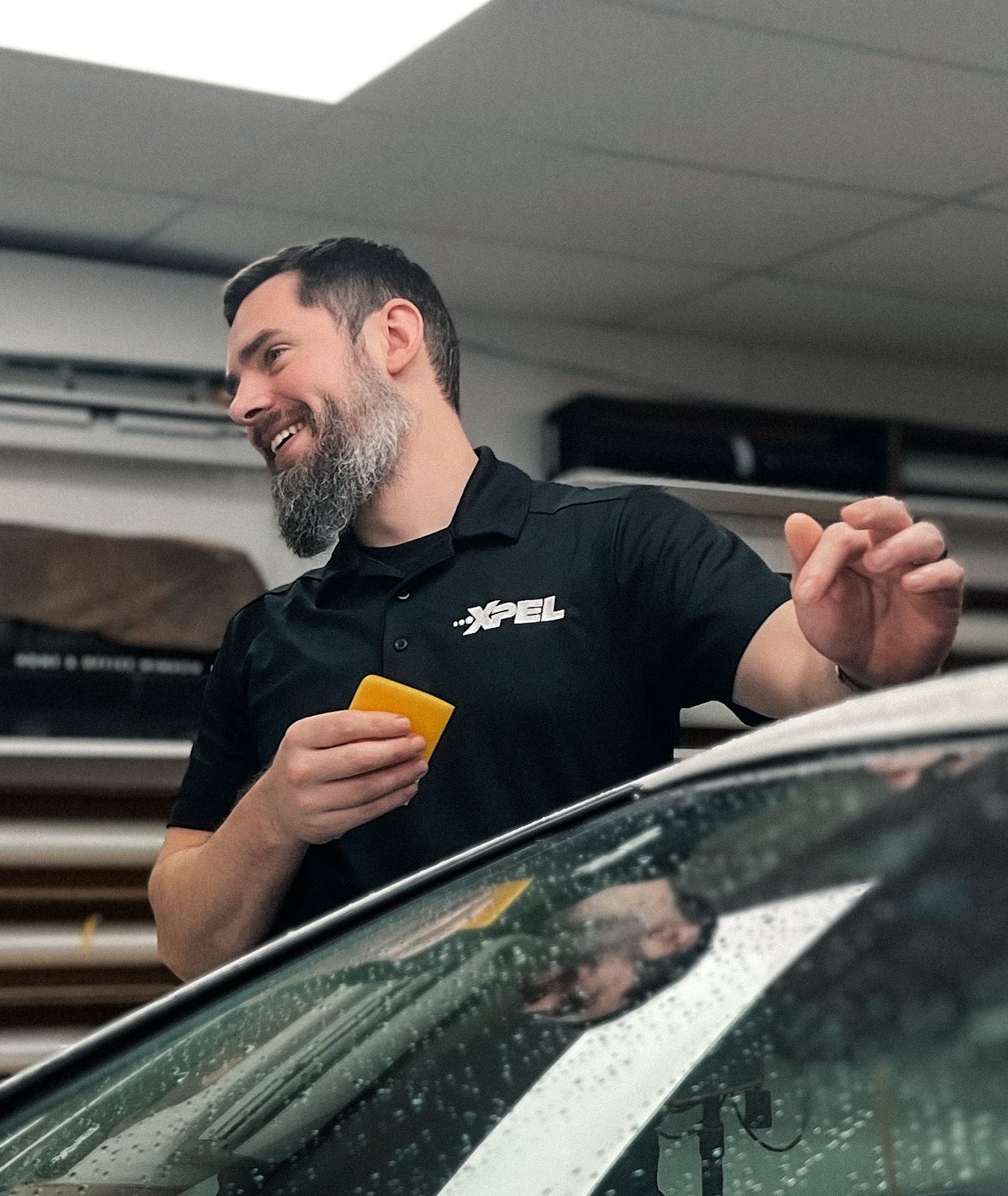 Man in gray t-shirt smiles; 