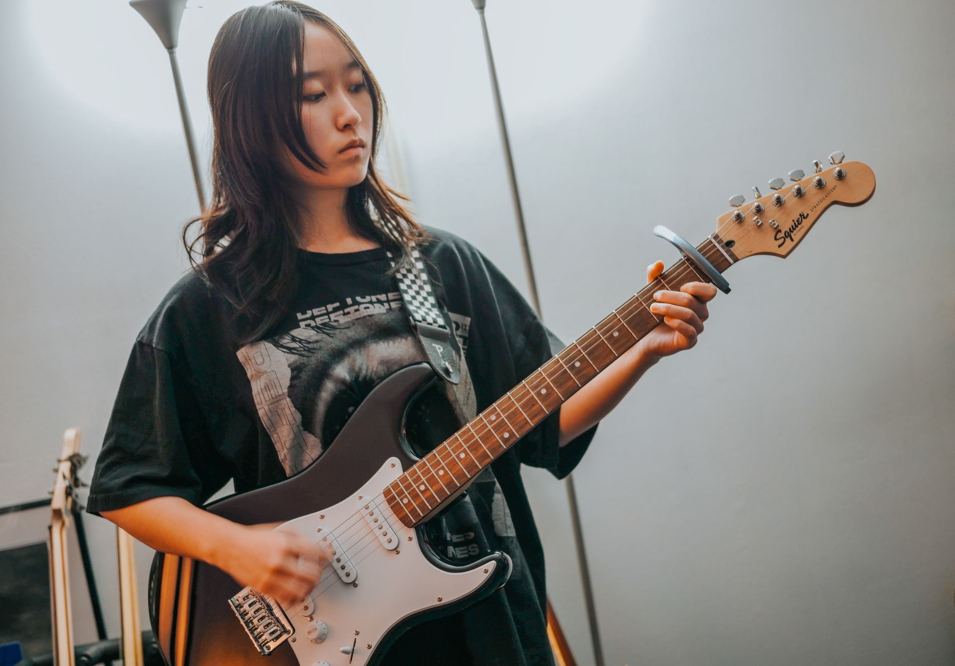 Teenage Girl Playing Guitar — Pearl City, HI — Hawaii Musicworks Teenage Girl Playing Guitar — Pearl City, HI — Hawaii Musicworks — Aiea — Kapolei — Ewa Beach — Honolulu — Wahiawa — Waipahu — Mililani
