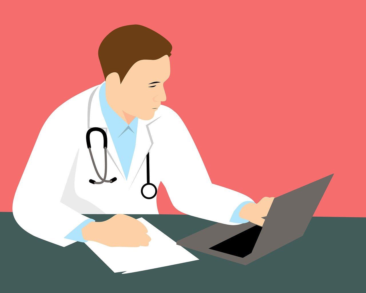 Doctor in white coat using a laptop at a desk on a pink background