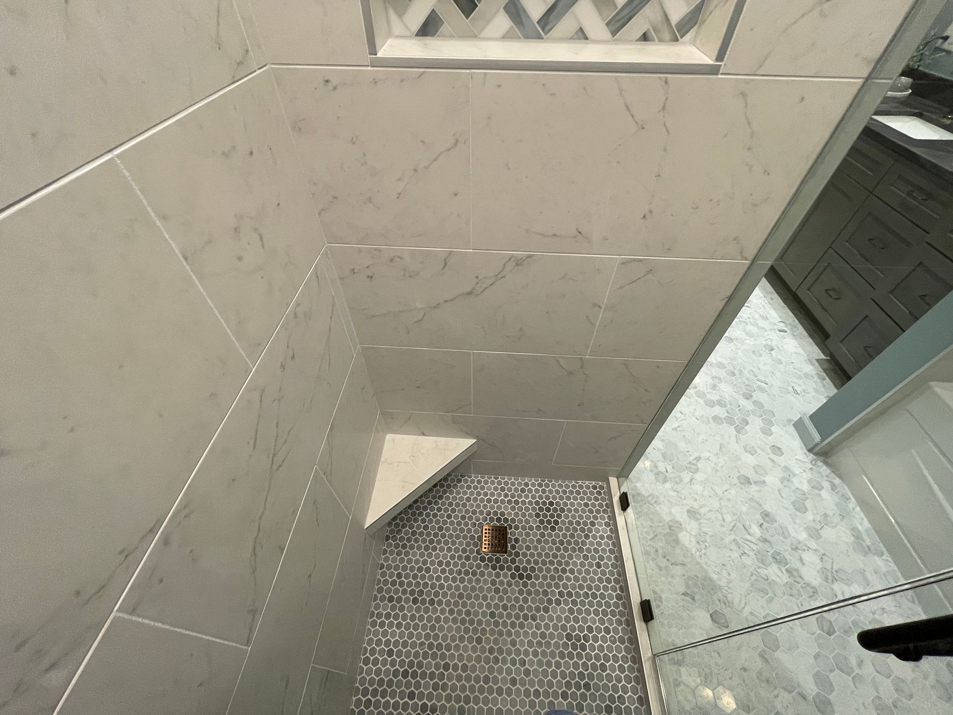 Tulsa Bathroom remodel spa shower stained glass mosaic tile inset marble floor gothic black granite counter