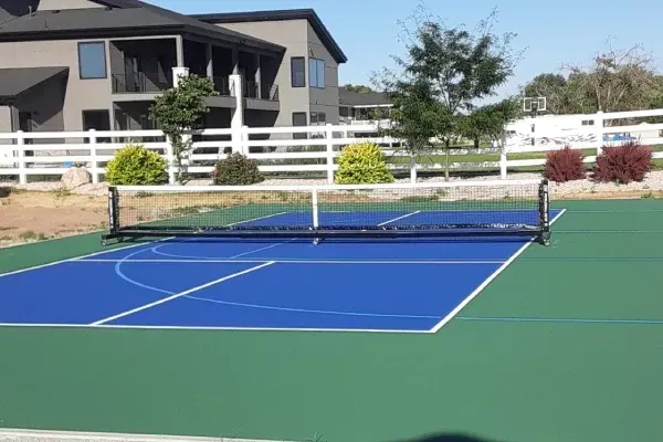 Custom sport court installation in Ogden UT creating durable outdoor courts for basketball tennis and multi-sport use