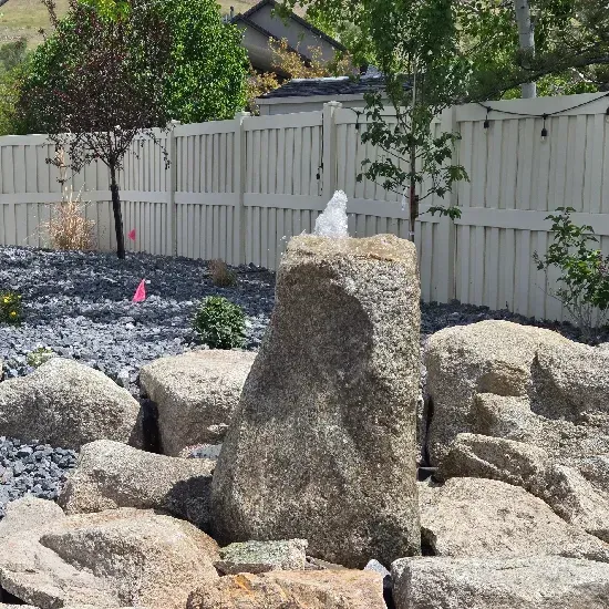Landscape boulder accent design in Ogden UT improving outdoor aesthetics with strategically placed natural rocks