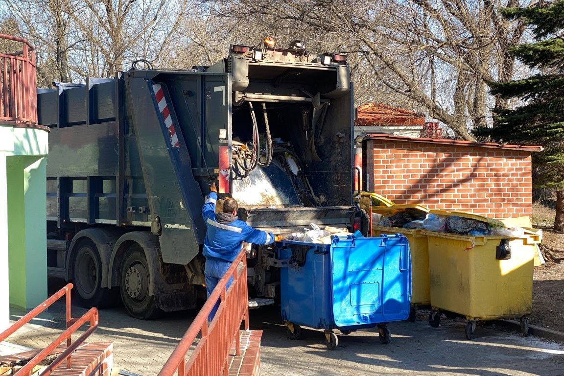 Crew clearing bulky construction trash items