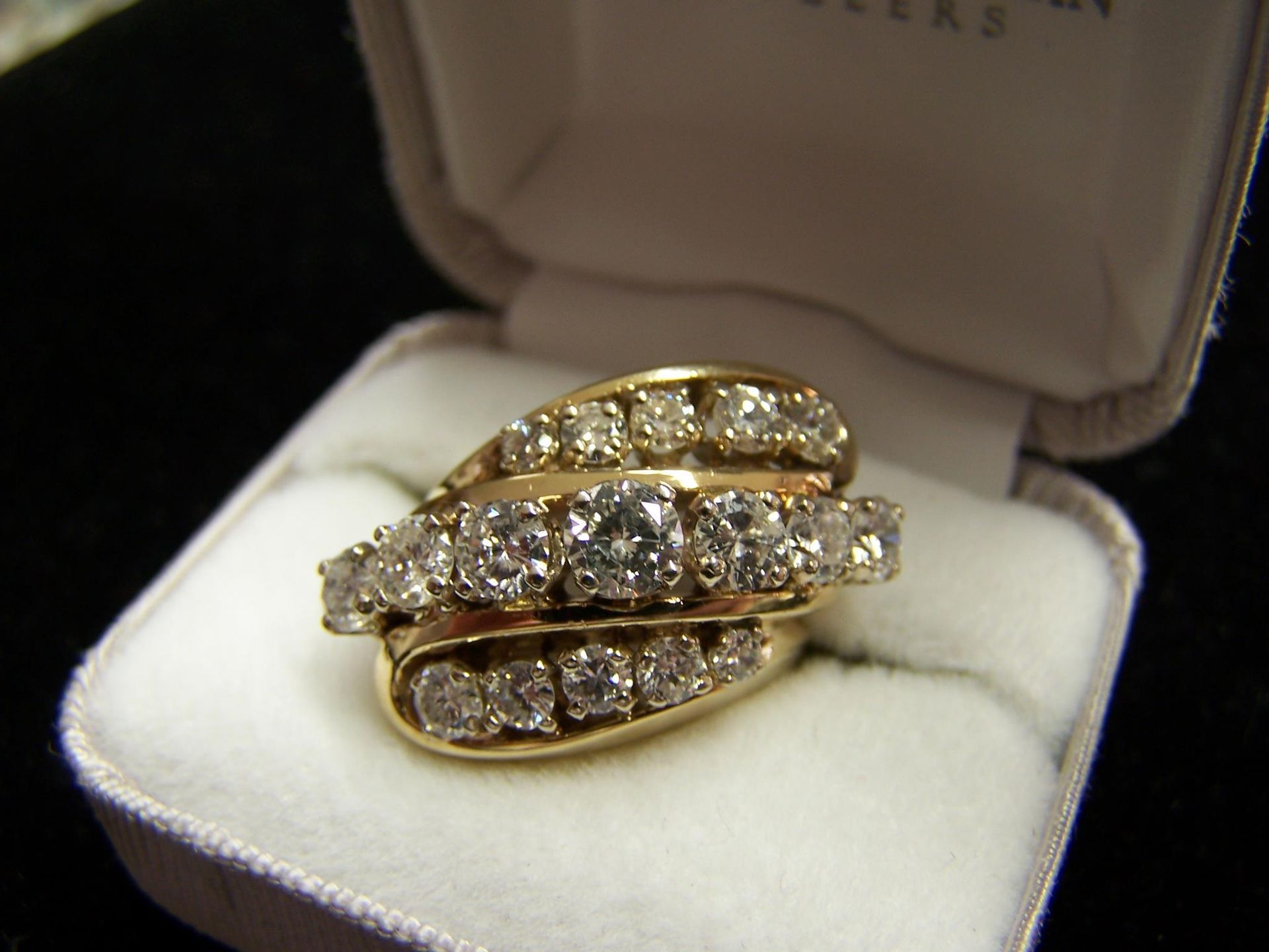 A ring in a box that says texas on it