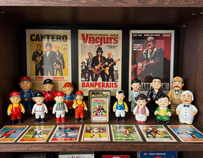 Display of vintage collectibles including toys and trading cards