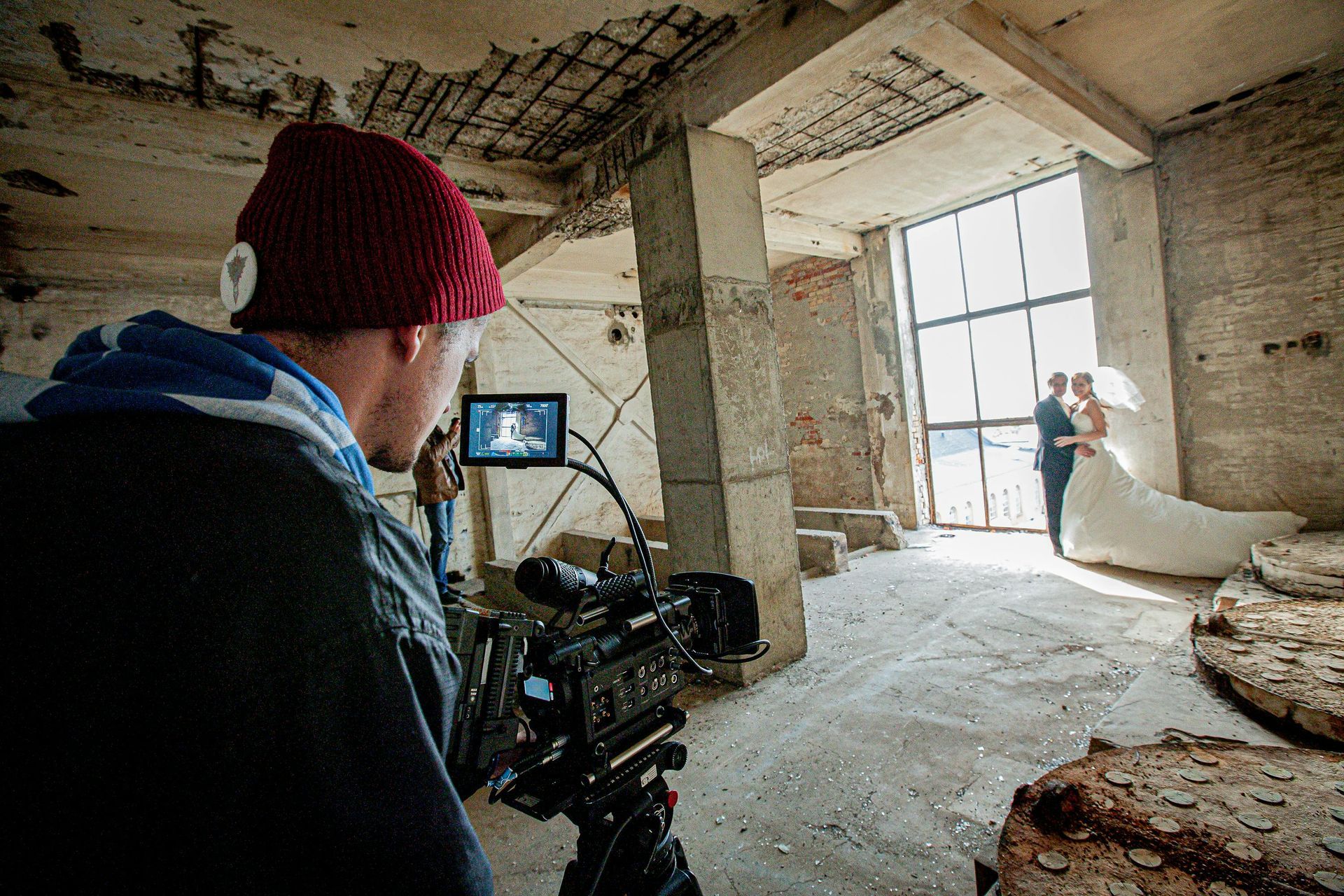 a person is holding a roll of film in their hand .