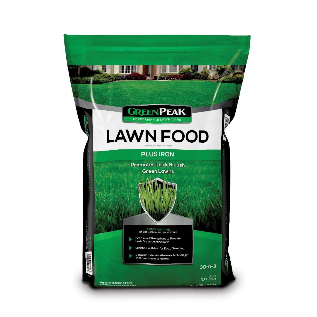 A bag of green peak lawn food on a white background.