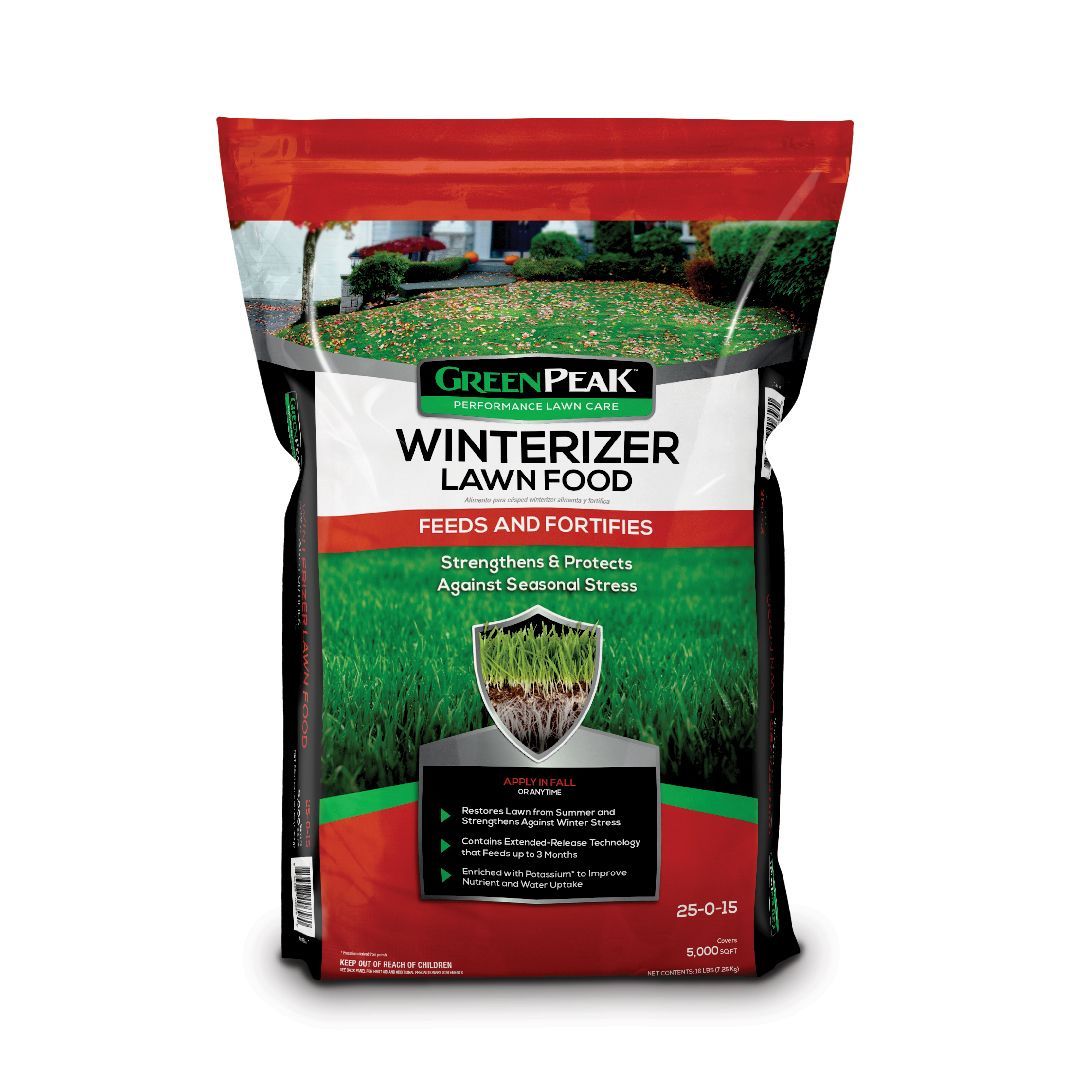 A bag of green peak winterizer lawn food on a white background.
