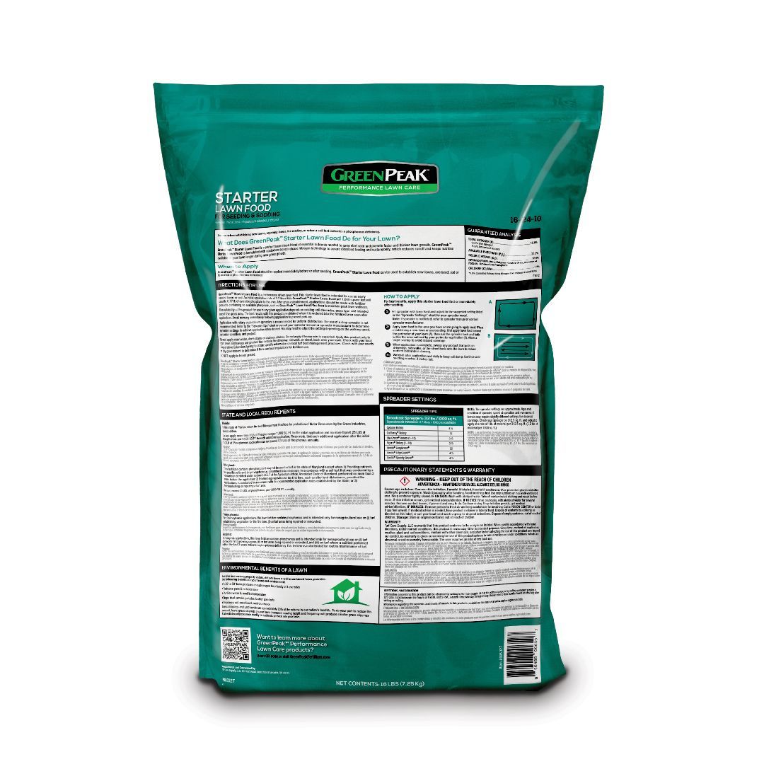 The back of a bag of green peak starter lawn food on a white background.