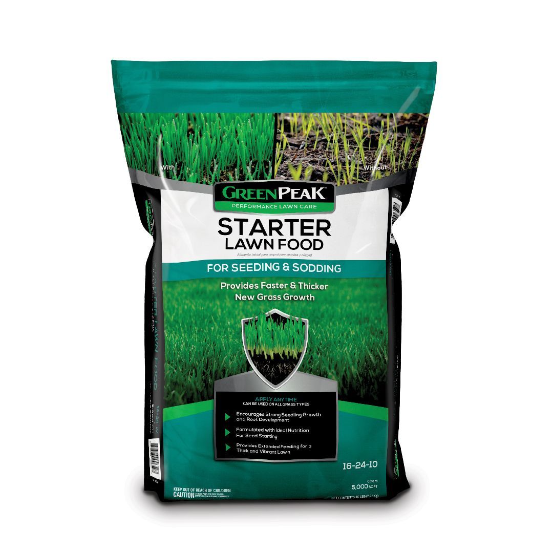 A bag of green peak starter lawn food on a white background.