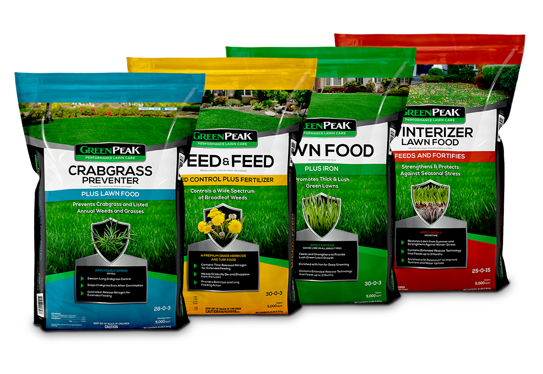 Bags of fertilizer lined up, representing the 4-app program of GreenPeak. Crabgrass, weed & feed, lawn food, and winterizer