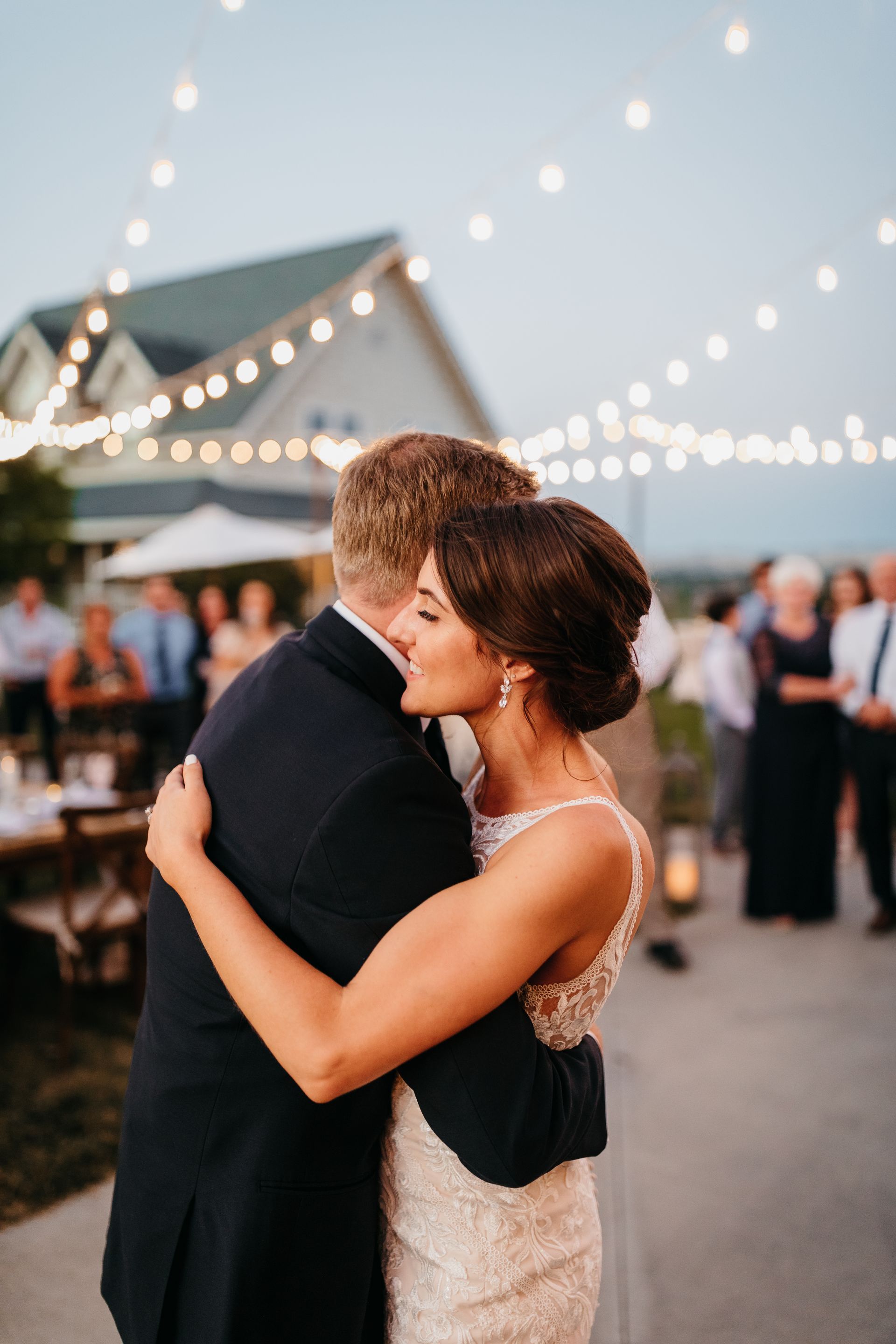 Wedding ceremony beneath the oak tree overlooking vineyard views at Ella's Vineyard