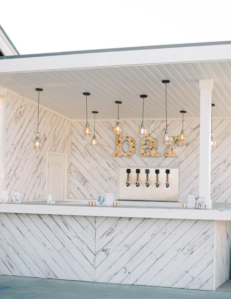 White wooden outdoor bar with 