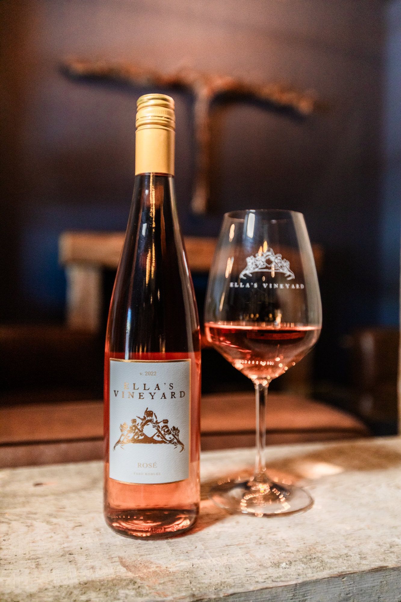Bottle and glass of rosé wine, label reads 