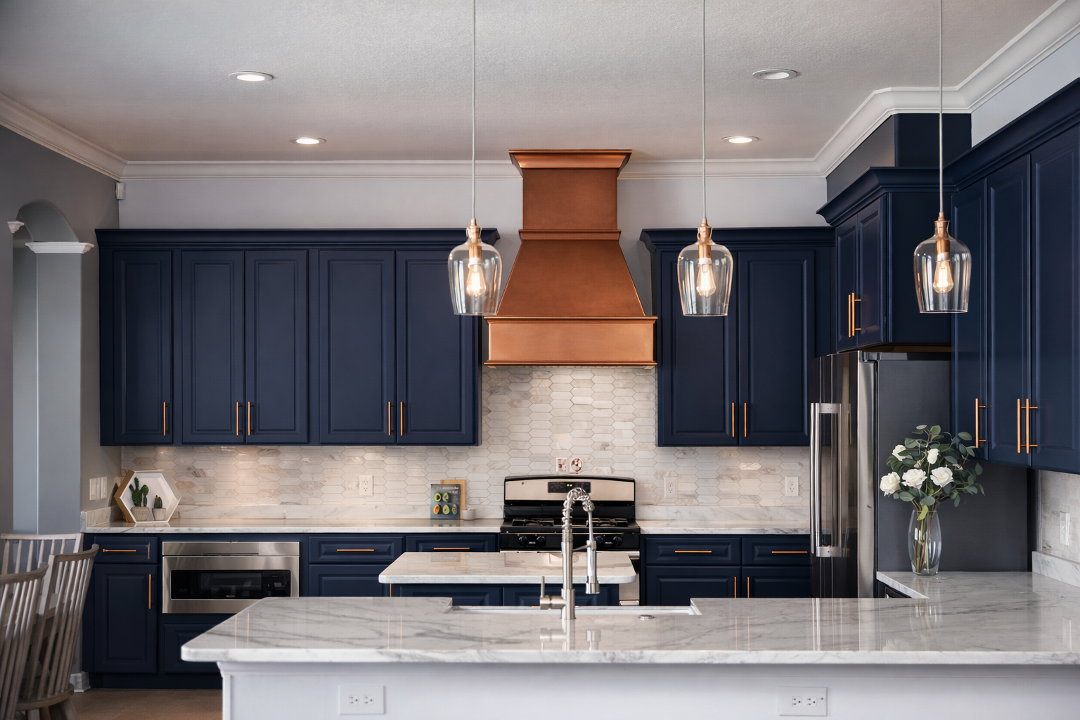 Modern kitchen with white and wood cabinets, island, stainless appliances.