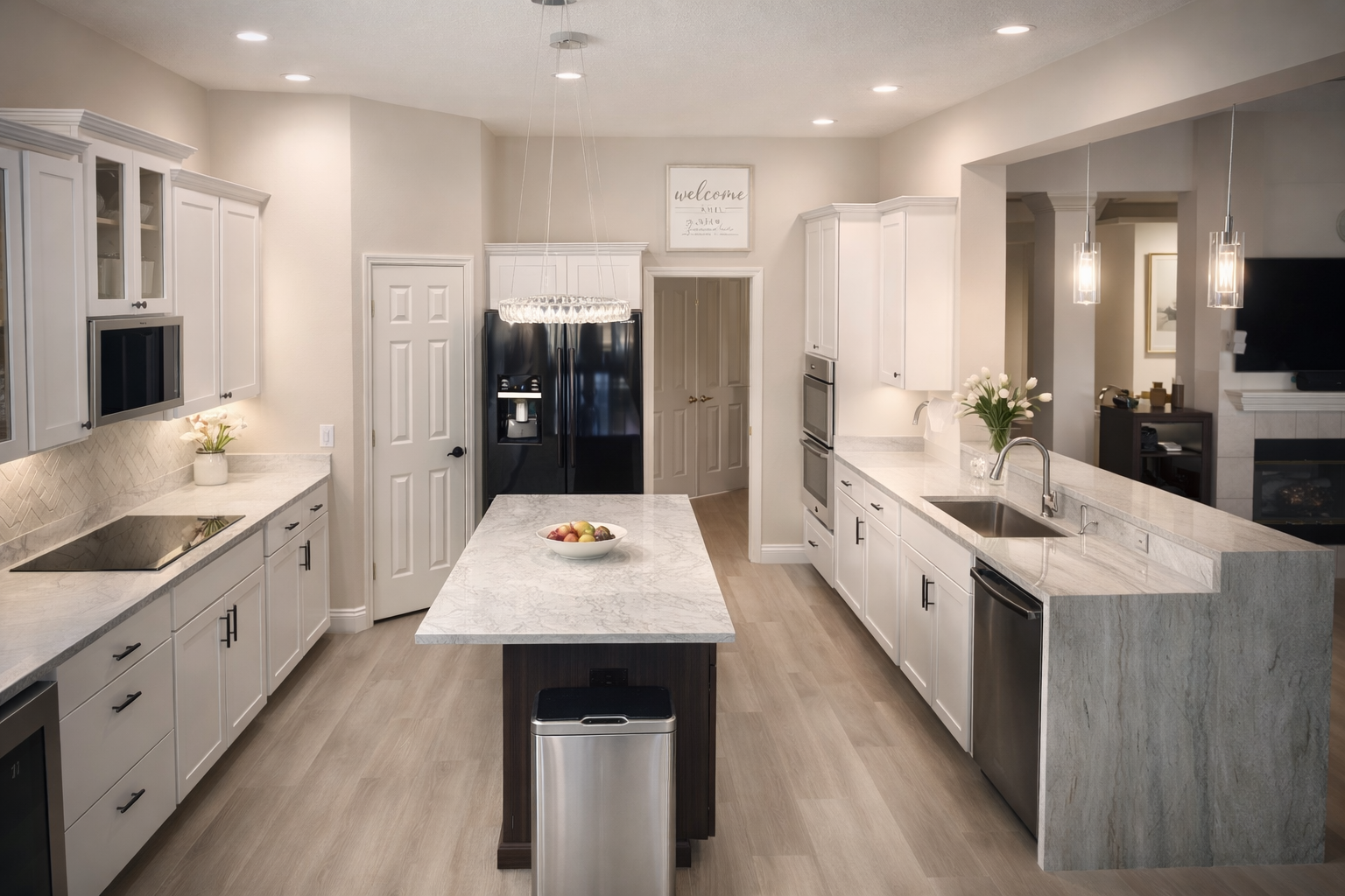 Modern kitchen with white cabinets, island, and appliances.