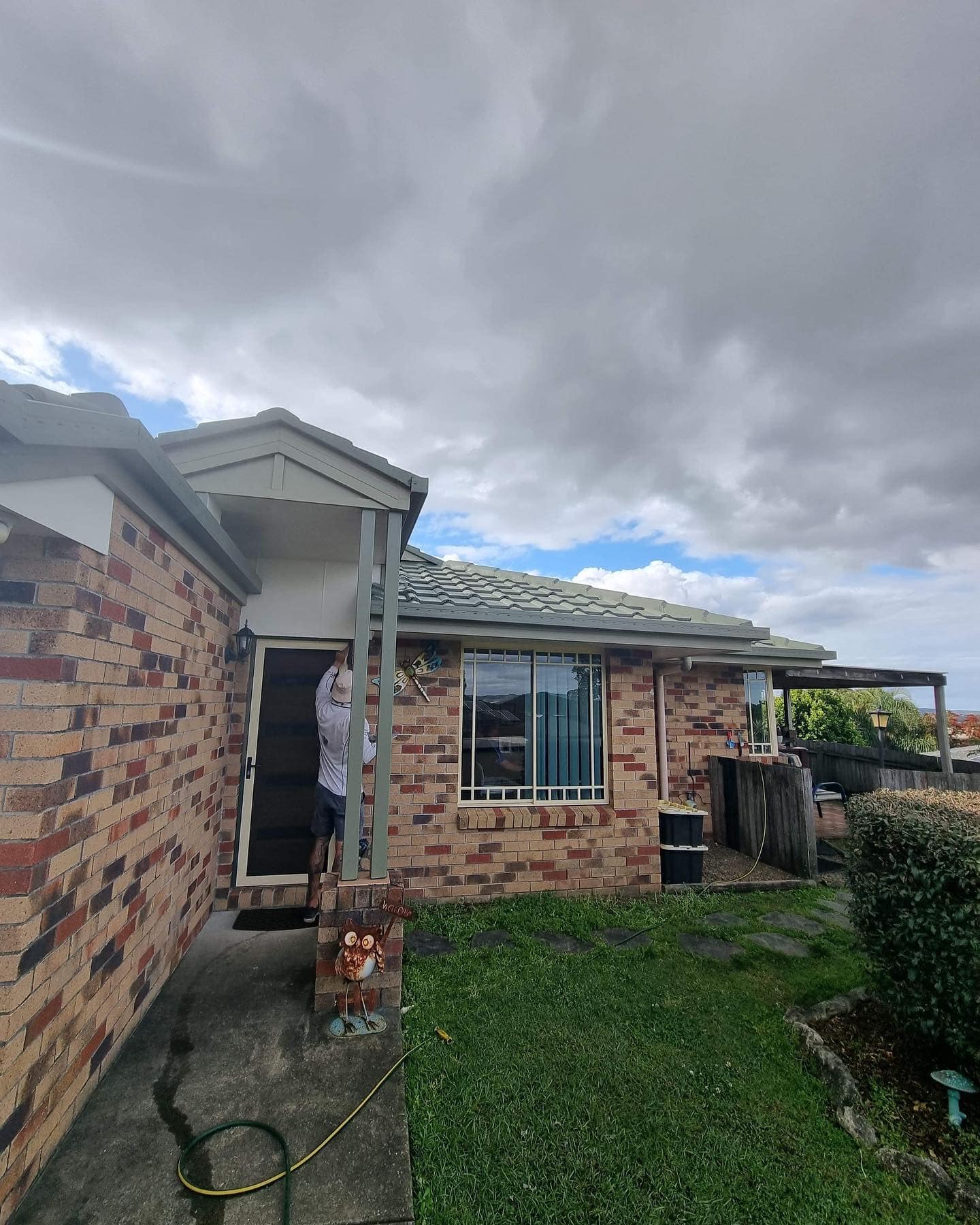 Roofer Installing Gutter - Roof Painting in Gold Coast, QLD