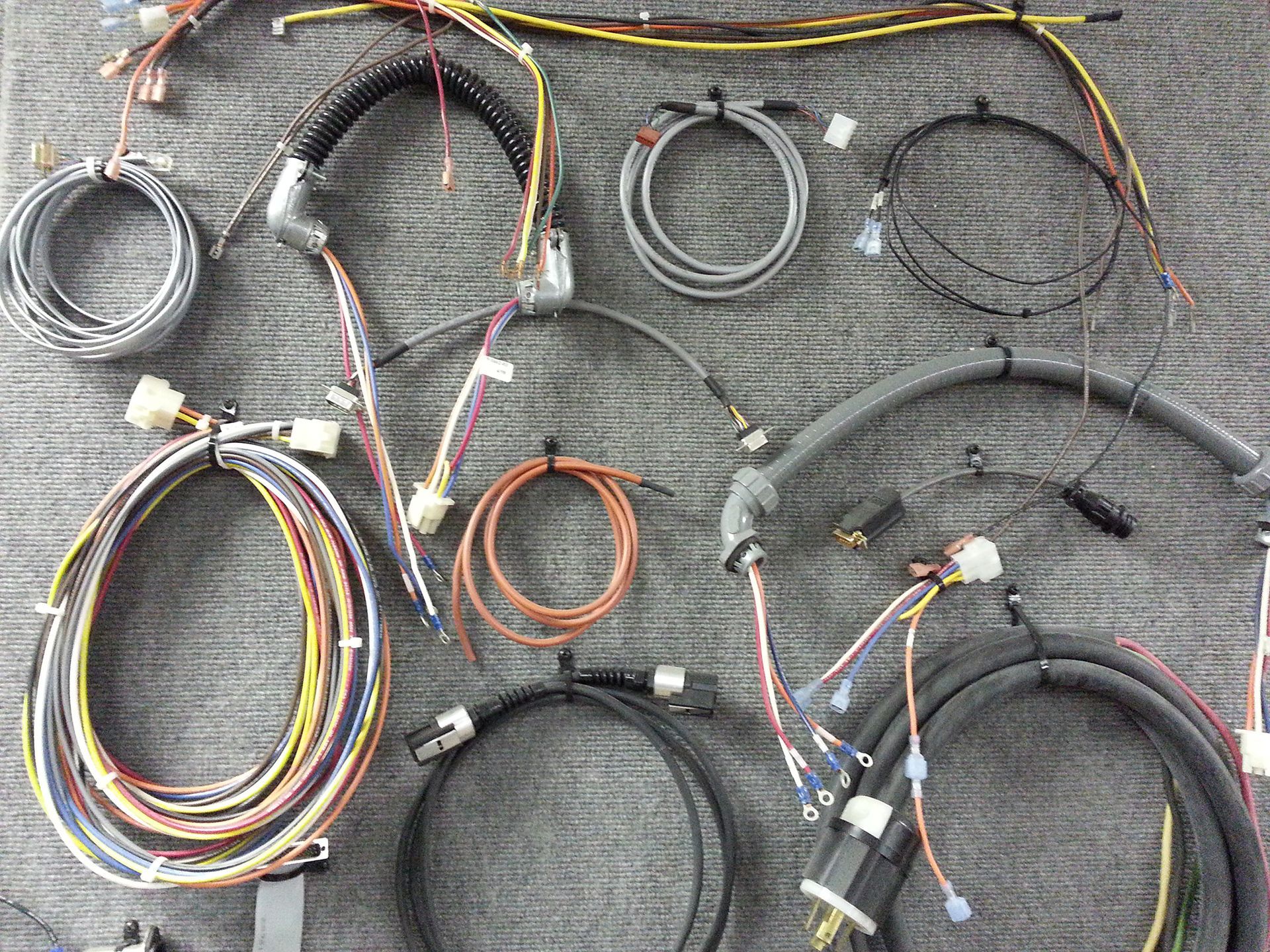 Assorted custom wire harnesses and coiled cable assemblies