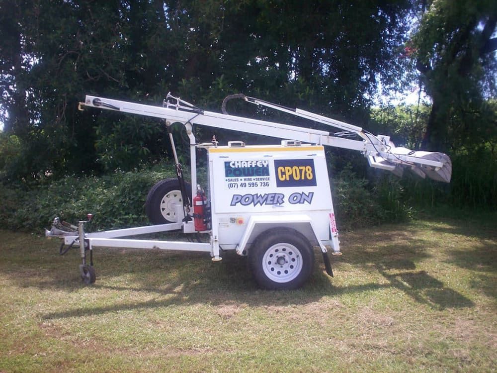 A White Trailer With a Yellow Sign That Says Power on — Chaffey Power in Blackwater, QLD
