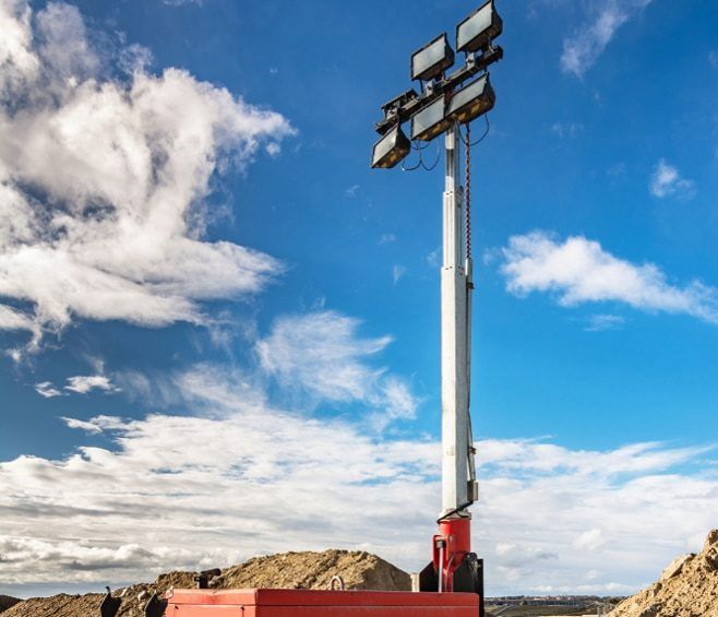 A Tower With a Lot of Lights on It is Sitting on Top of a Dirt Hill — Chaffey Power in Moranbah, QLD