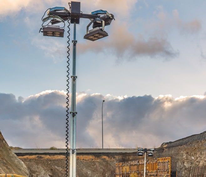 A Very Tall Light Pole With a Lot of Lights on It — Chaffey Power in Gladstone, QLD