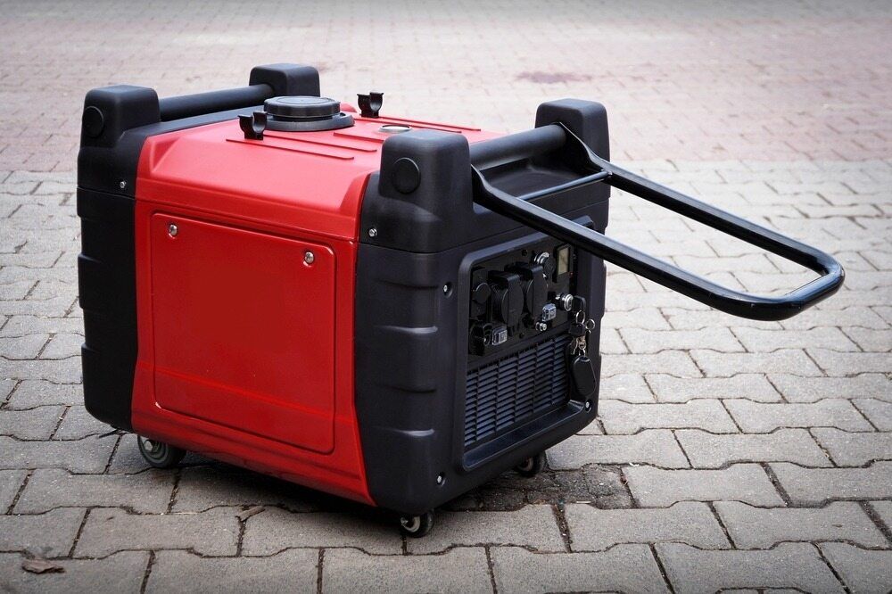 A Red and Black Generator is Sitting on a Brick Sidewalk — Chaffey Power in West Mackay, QLD