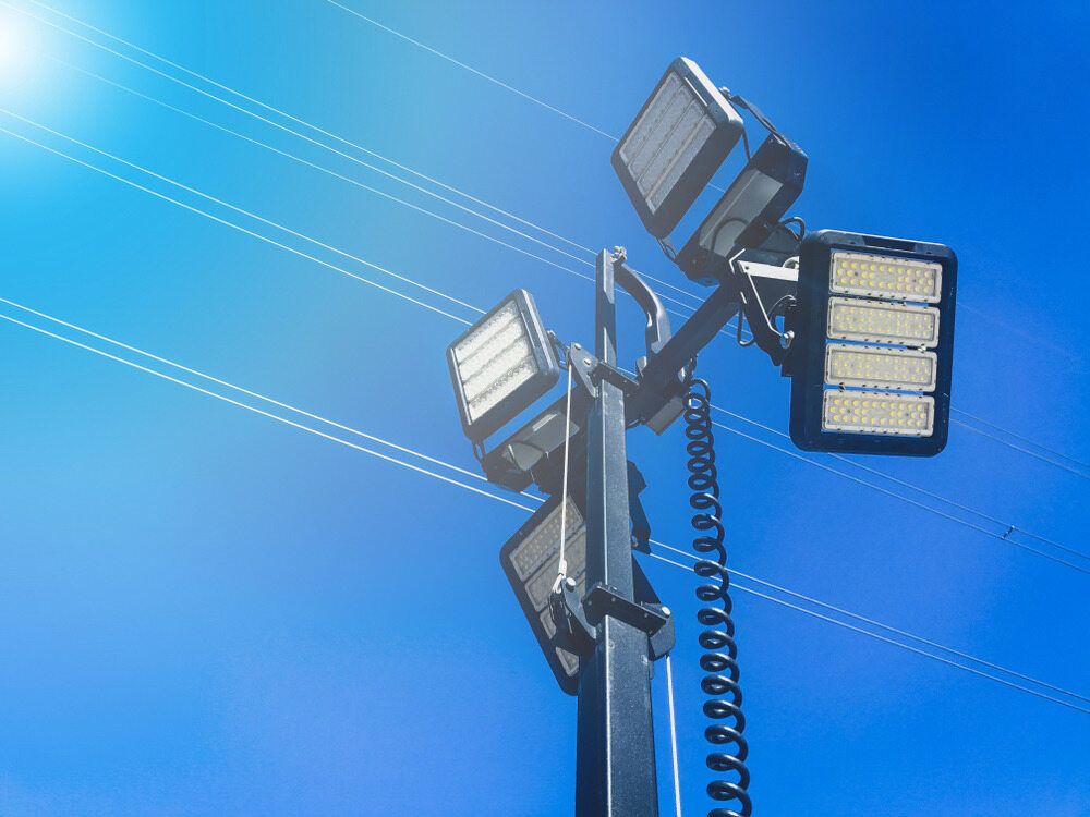 A Tower With a Lot of Lights on It Against a Blue Sky — Chaffey Power in Blackwater, QLD
