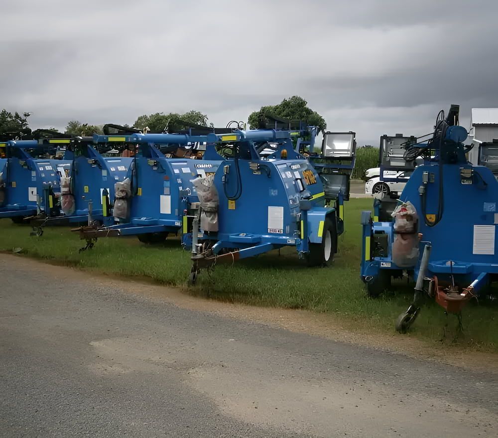 A Row of Blue Trailers Are Parked on the Side of the Road — Chaffey Power in West Mackay, QLD