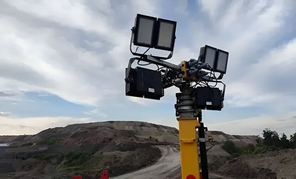 A Tower With a Lot of Lights on It is in the Middle of a Dirt Road — Chaffey Power in West Mackay, QLD