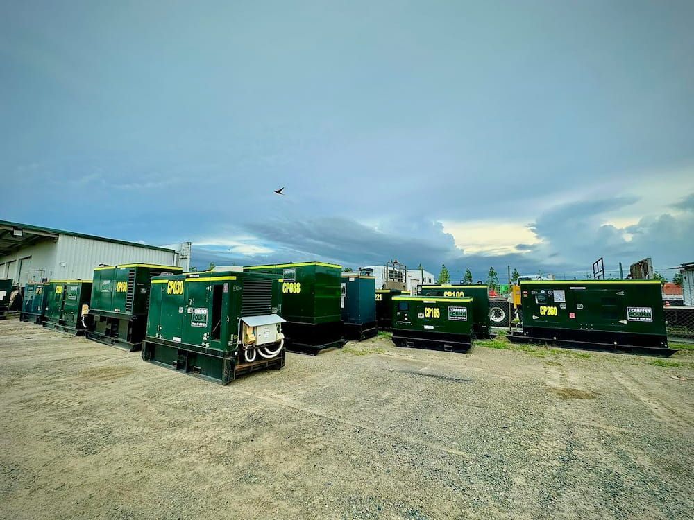 A Row of Green Trucks Are Parked in a Gravel Lot — Chaffey Power in West Mackay, QLD