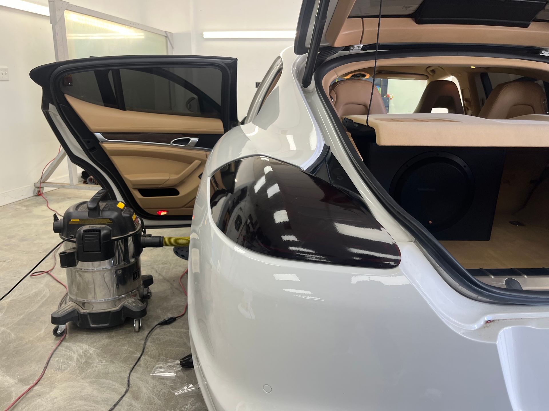 Custom audio enclosure installed in a white Porsche
