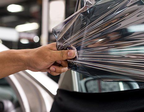 Removing Old Film — Stockton, CA — West Coast Car Audio Removing Old Film — Stockton, CA — West Coast Car Audio