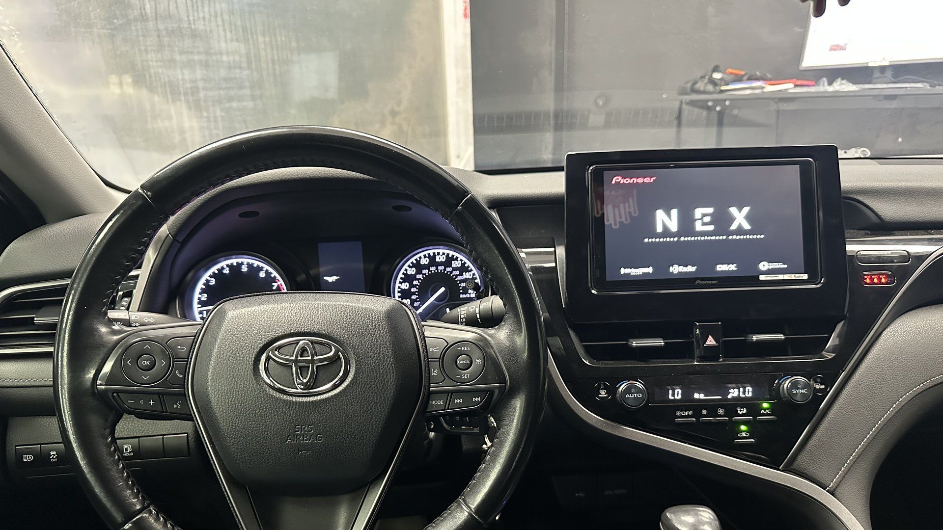 Toyota Camry dash with a Pioneer NEX touchscreen head unit installed