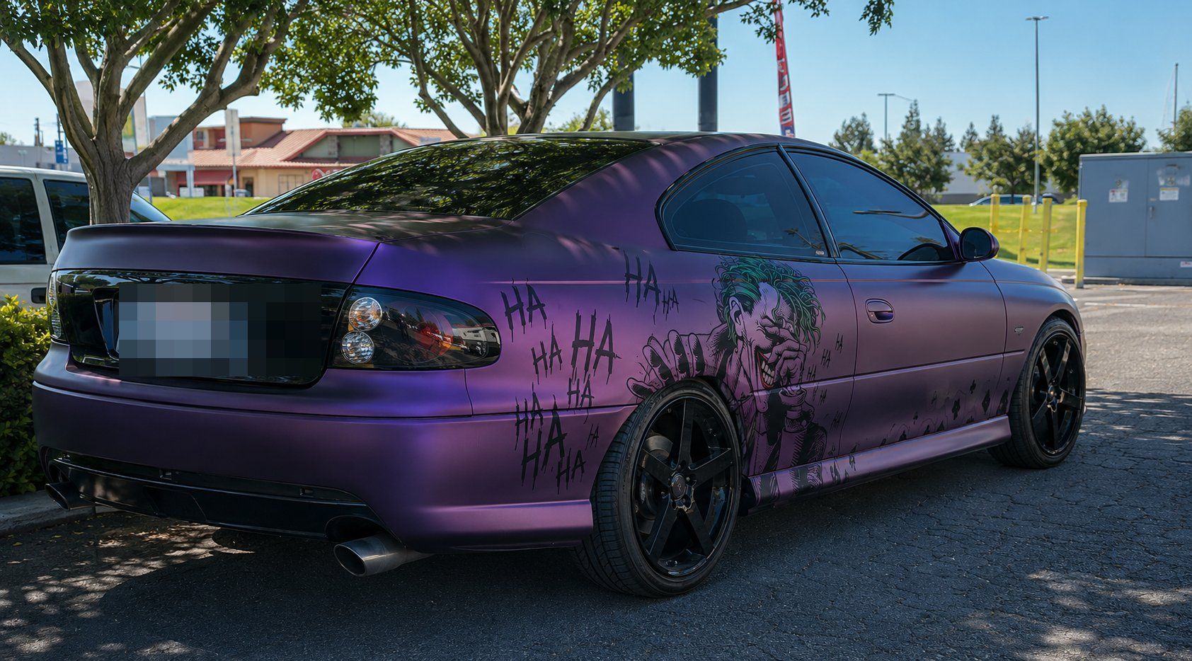 Purple Pontiac GTO parked outside