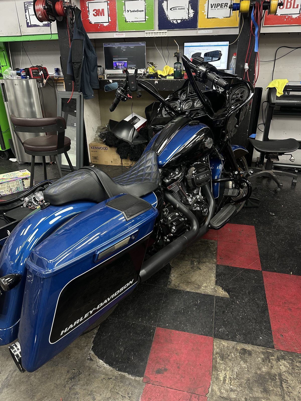 Blue Harley-Davidson touring bike in the West Coast shop