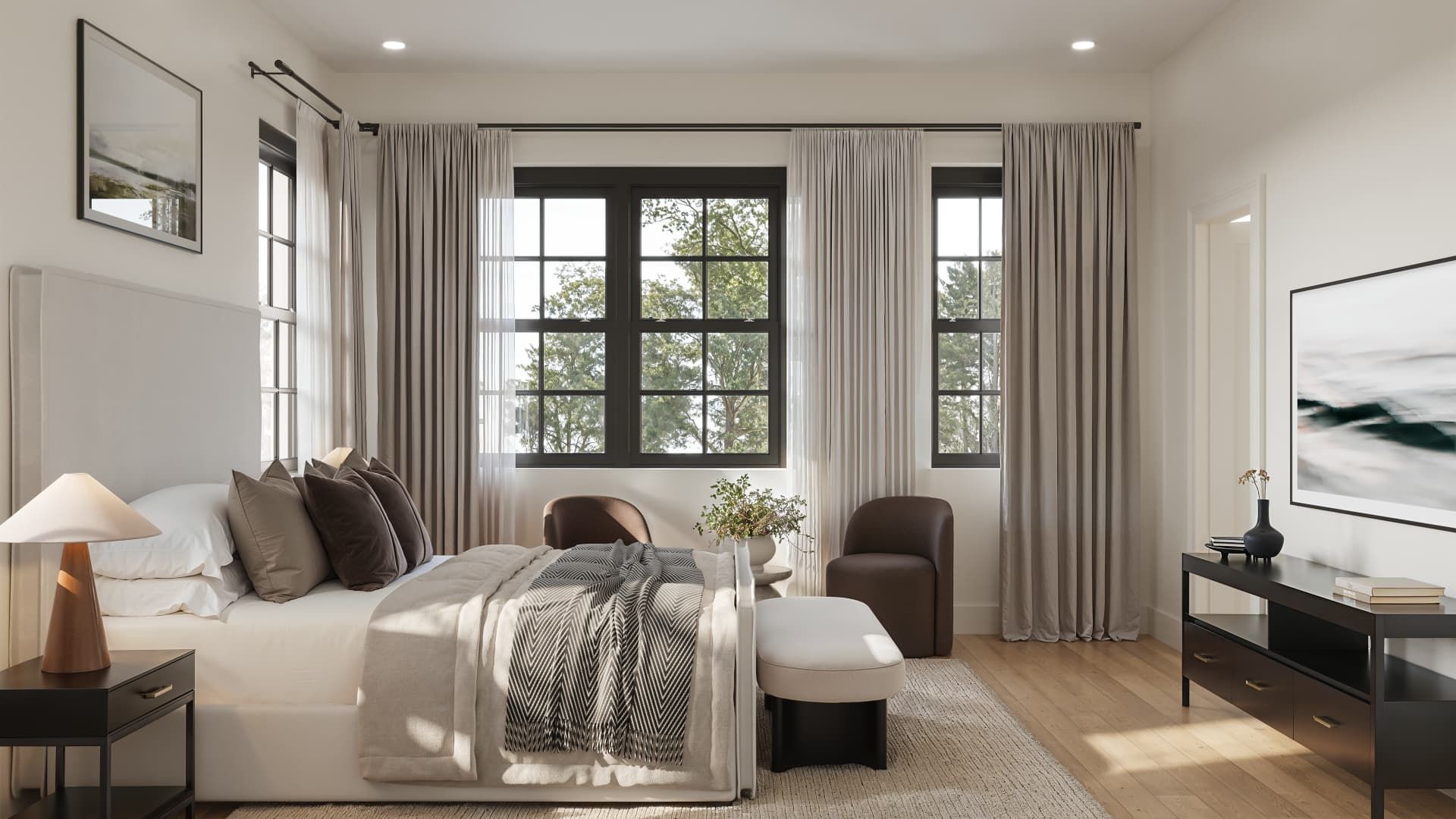 Bedroom with a bed, large windows, chairs, and neutral-colored curtains.