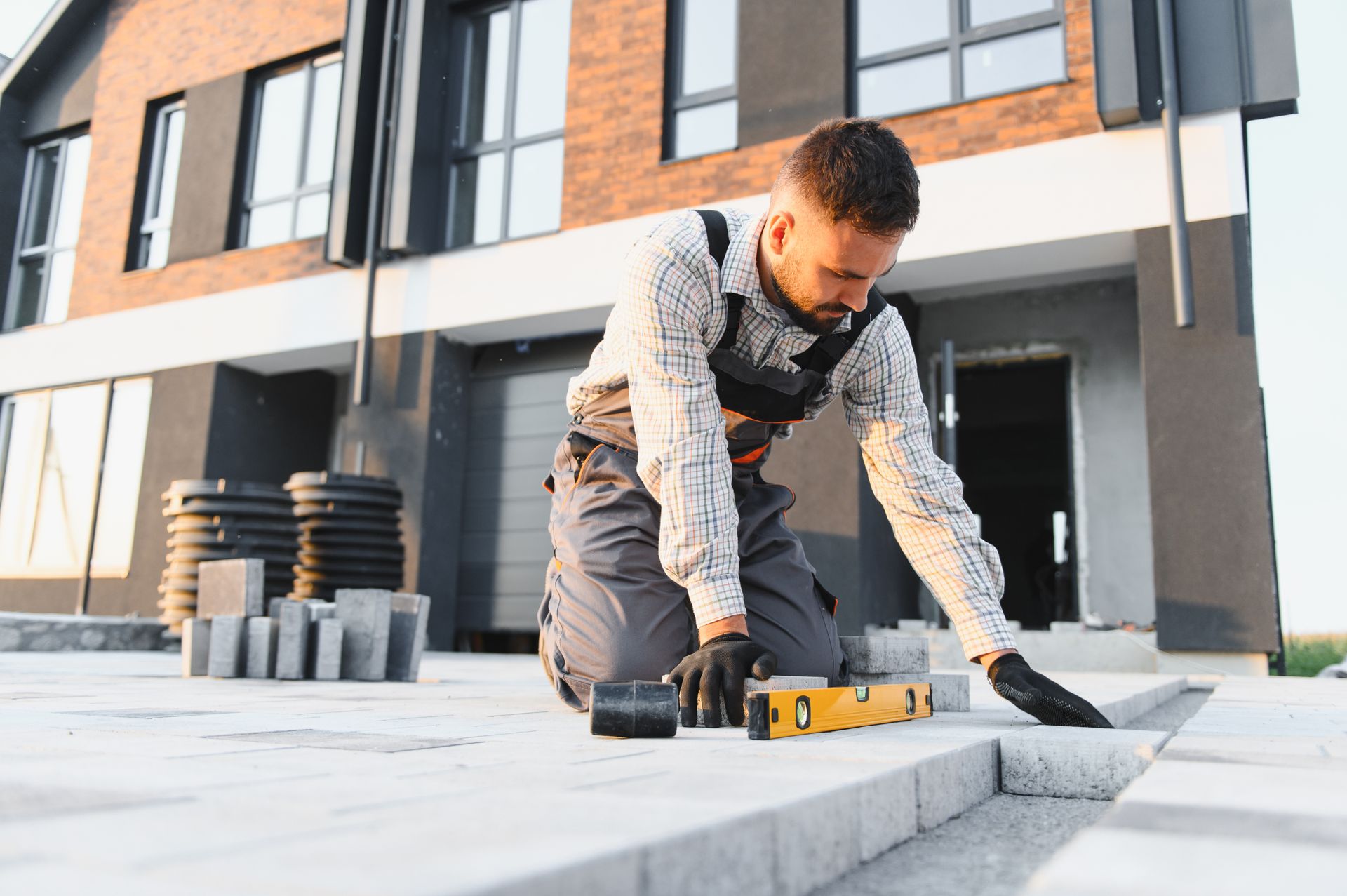 Driveway paving contractor installing new asphalt driveway in Frankfort, NY