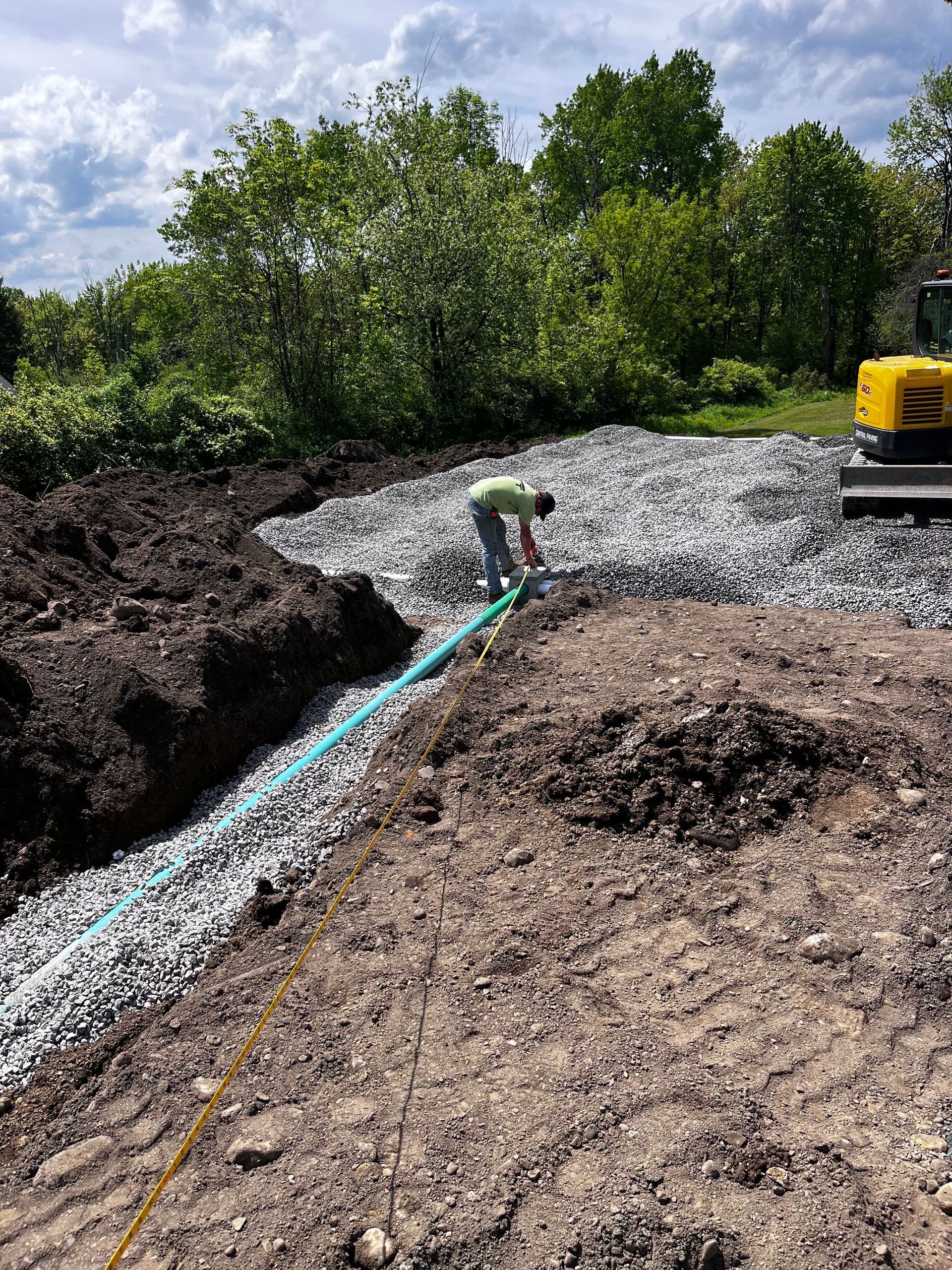 Laying Pipe in Trench
