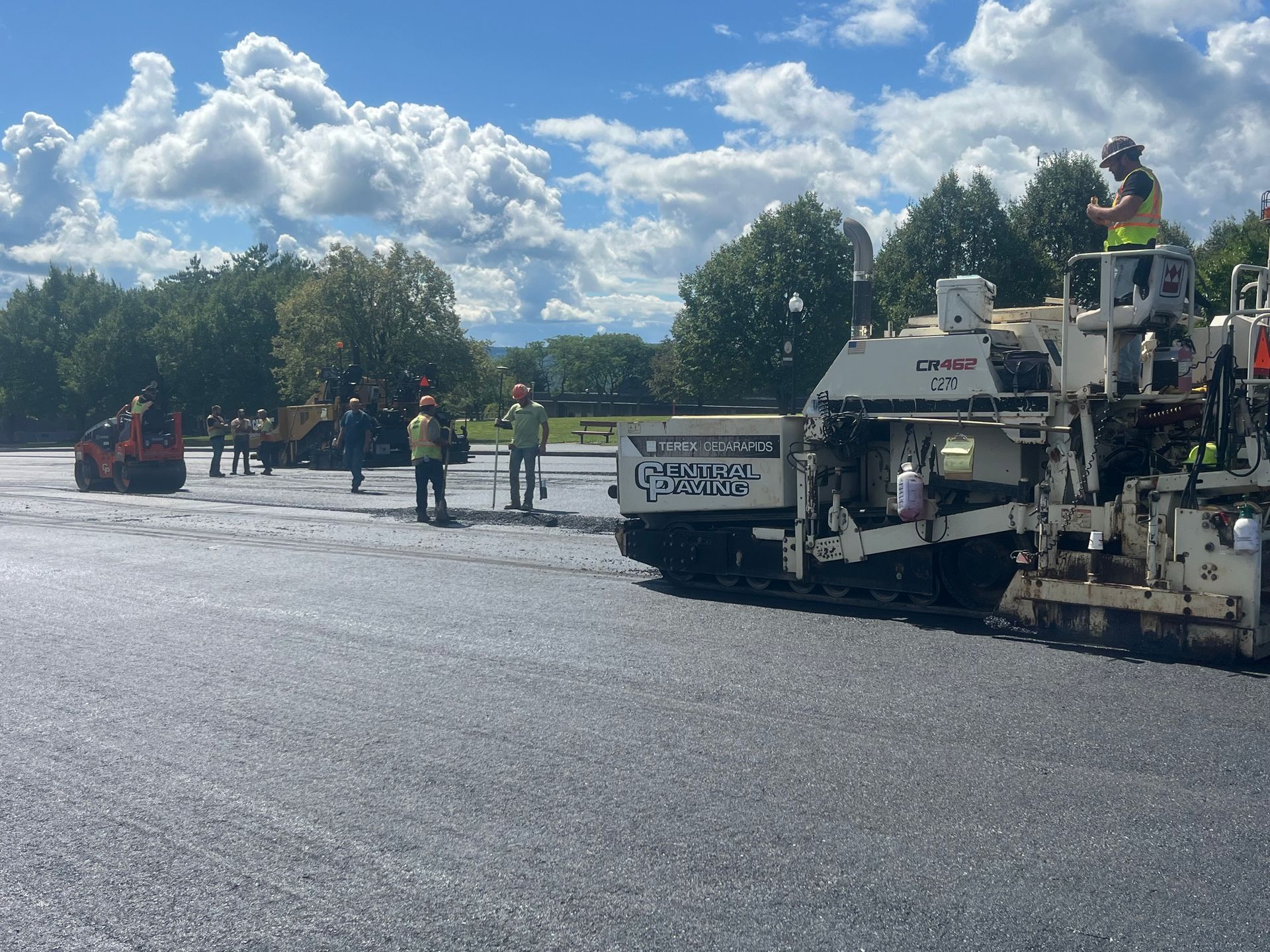 Workers Laying Asphalt Workers Laying Asphalt