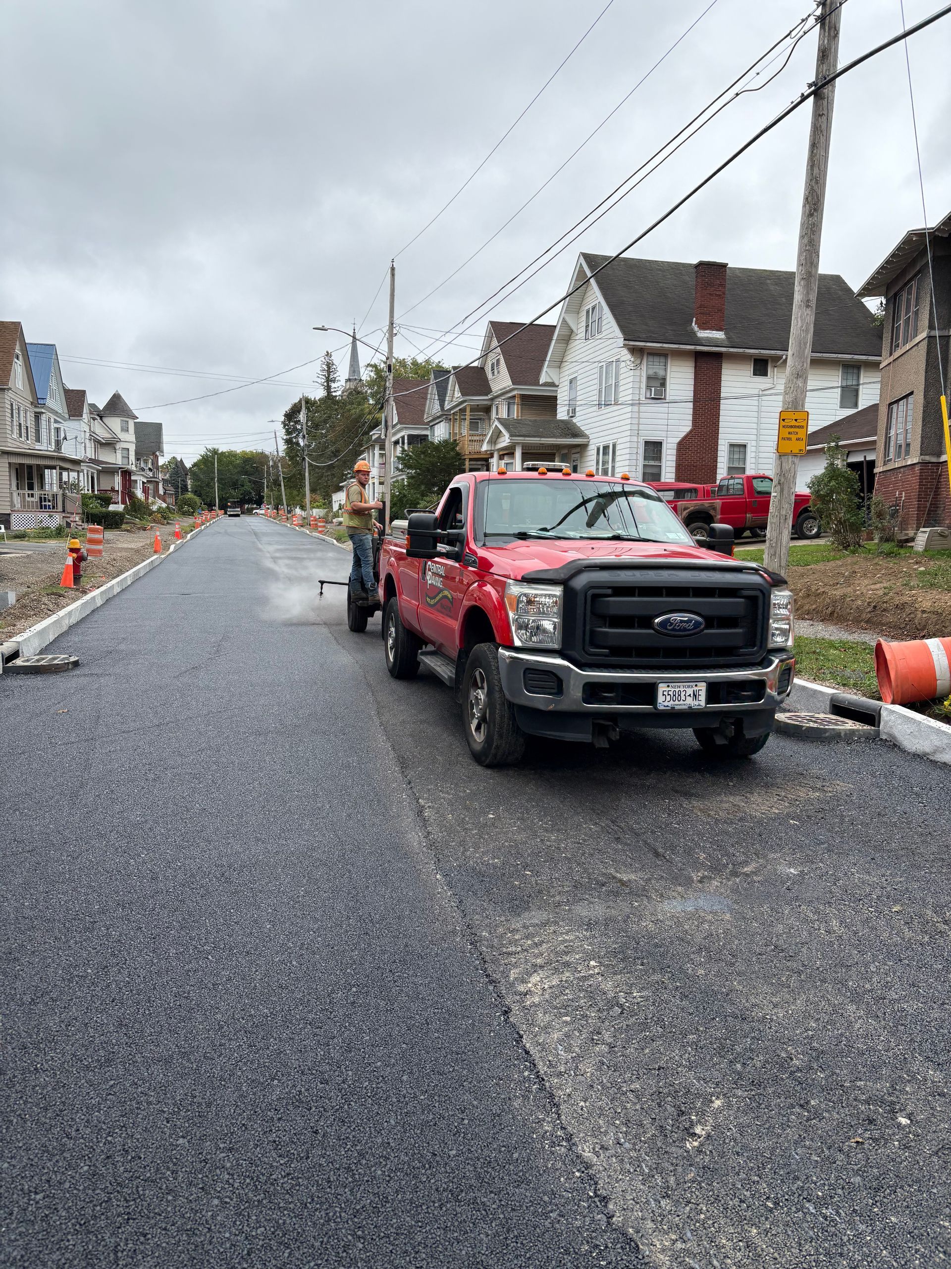 Red Truck On Paved Street

