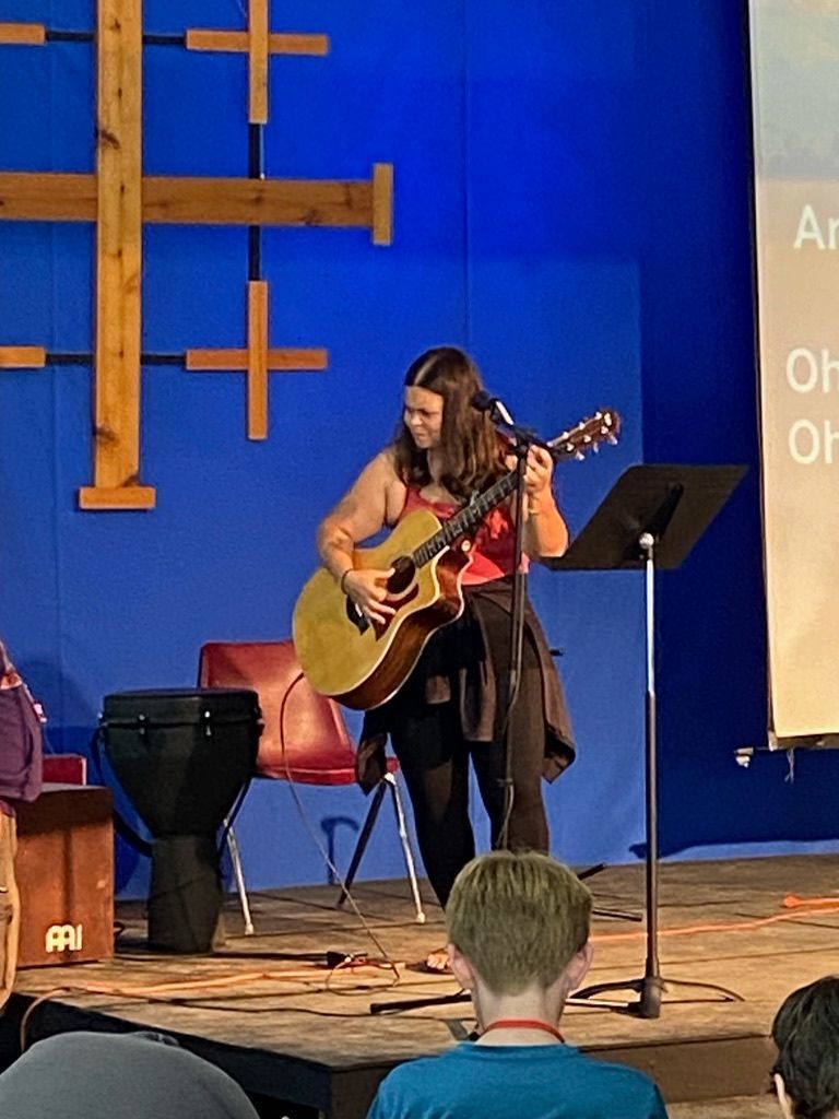 A woman leads worship for the youth group at Aldersgate United Methodist Church in north Durham 