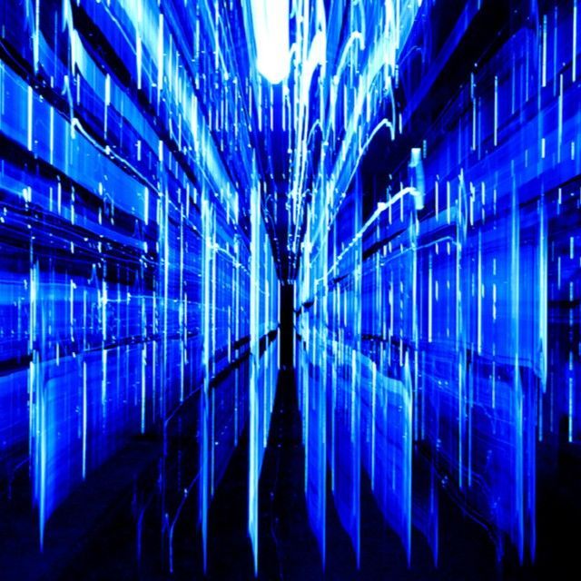 A hallway with a lot of blue lights coming out of it
