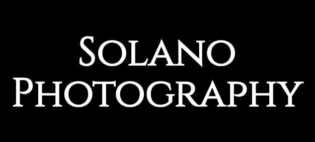 A black background with white text that says solano photography