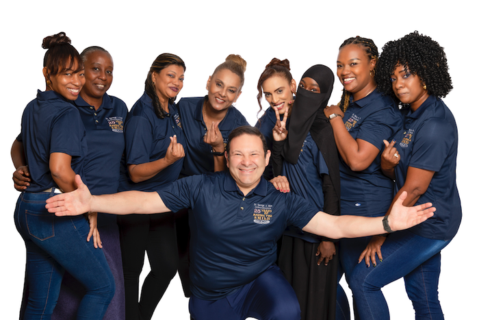 A group of people are posing for a picture together.
