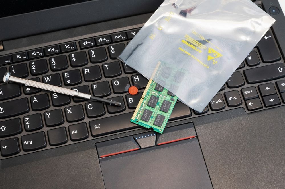 RAM Is Upgraded And Placed In ESD Packaging On A PC Keyboard — Essential Computer Repairs In Buderim QLD
