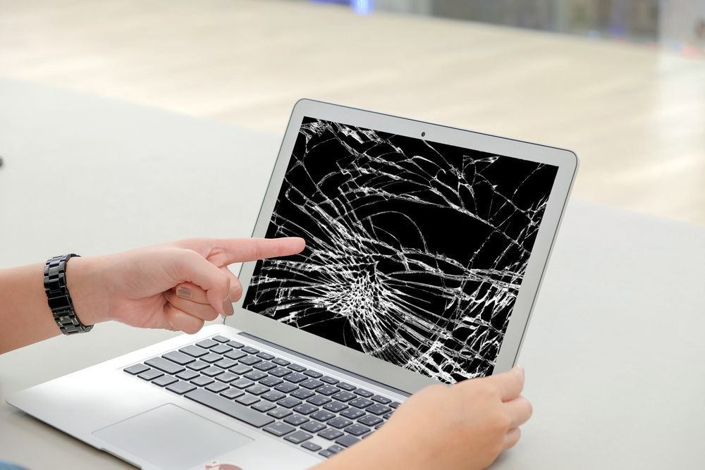 Pointing At The Laptop Screen Broken — Essential Computer Repairs In Buderim QLD