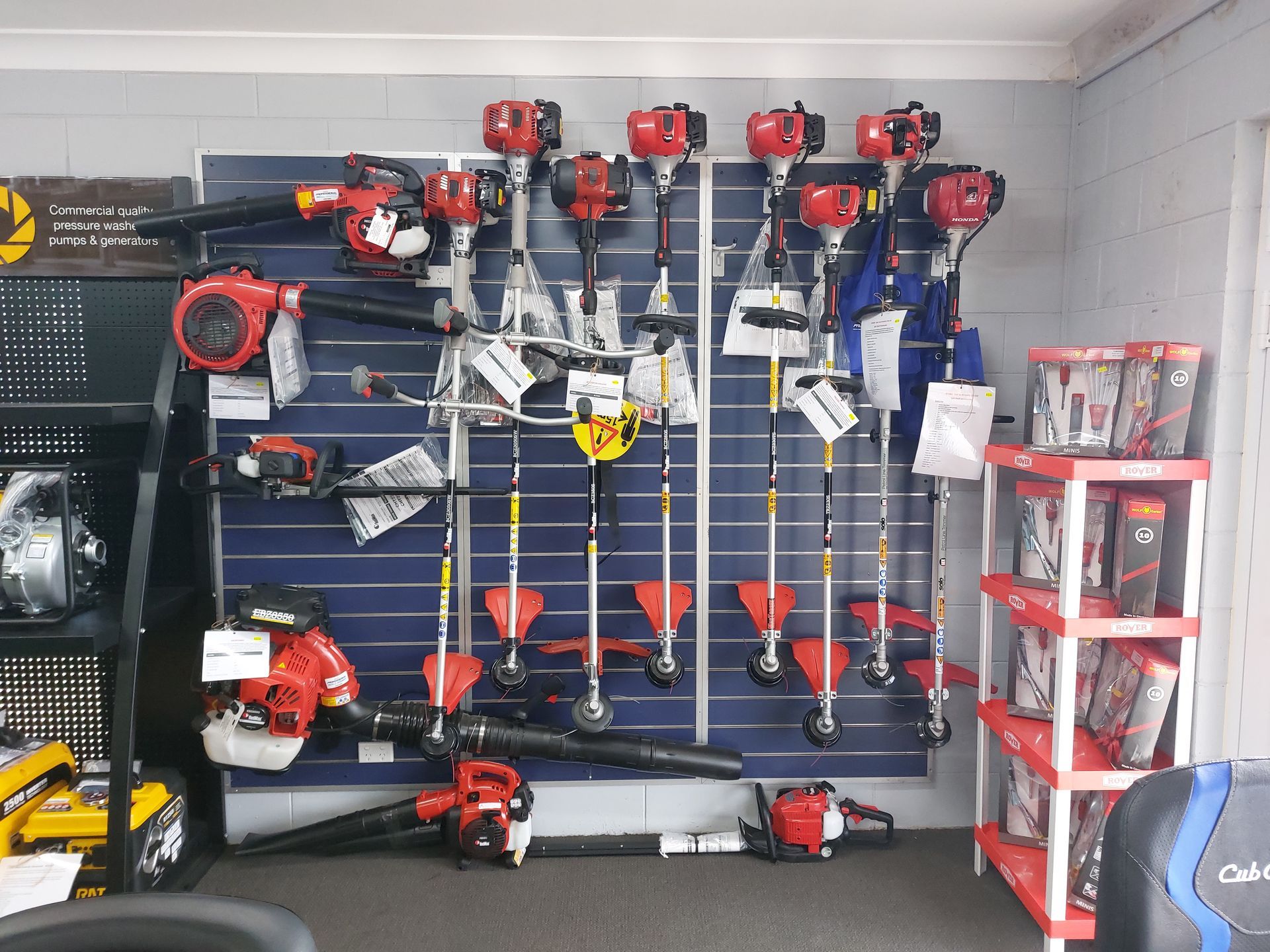 A Hardware Store Display Featuring Various Red-Black Coloured Power Tools — Professional Small Engines in Aitkenvale, QLD