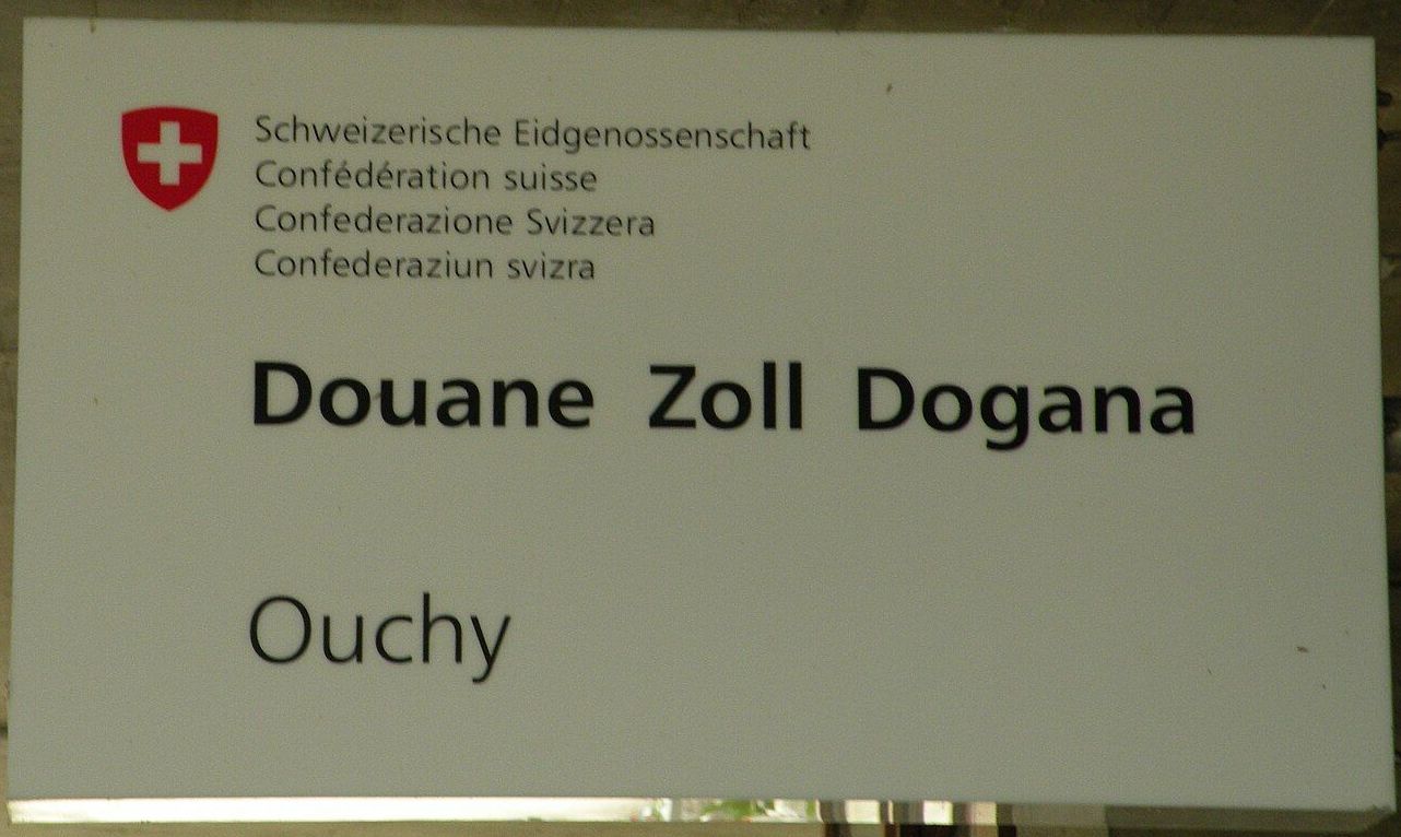 A sign that says douane zoll dogana on it