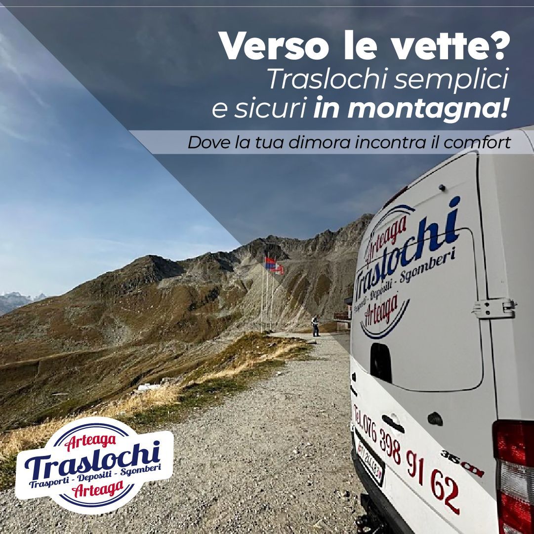 A white van is parked on a dirt road in front of a mountain.