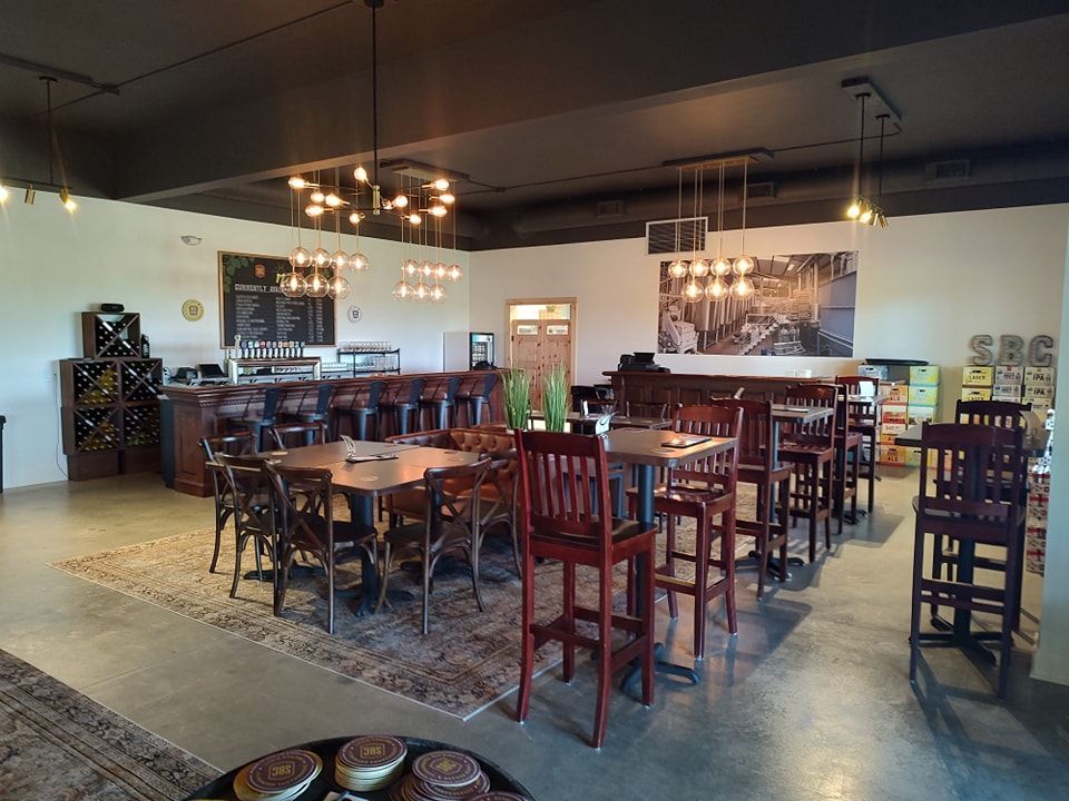 A large room with tables and chairs in it